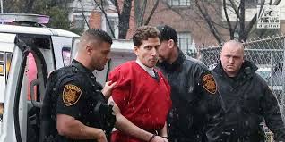 A man in red is being arrested by two police officers.