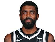 A close up of a basketball player with a beard