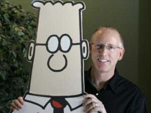 A man holding up a large picture of beaker.