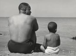 A black and white vintage picture of a man and a son