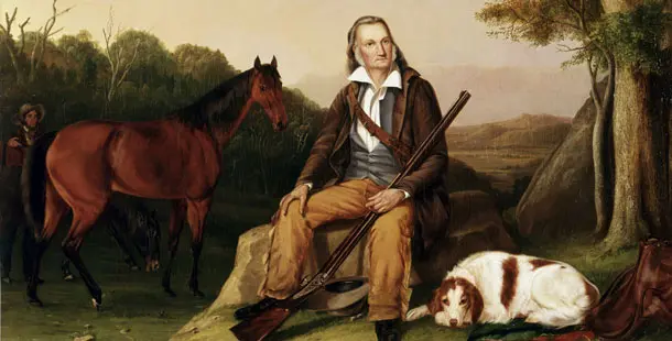 A painting of a man sitting on the ground with two dogs and a dog.