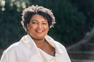 Stacey Abrams wearing a white dress