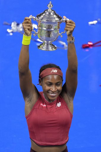 A woman holding up her arms in the air.