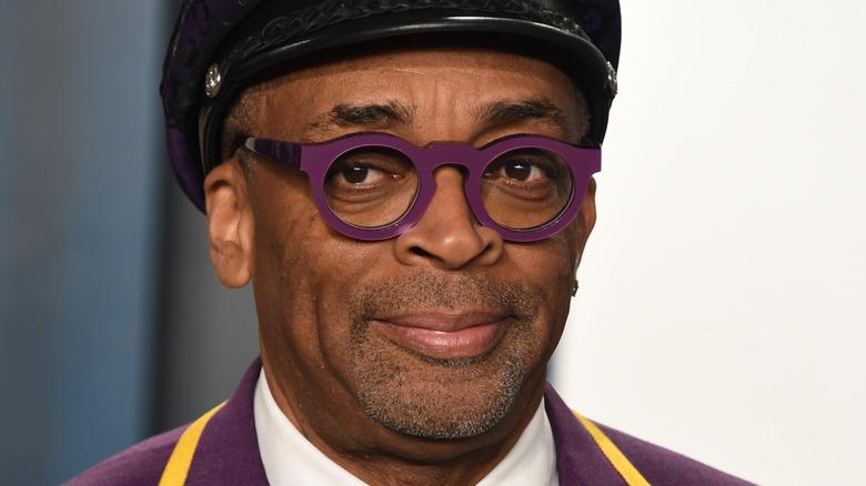 A close up of spike lee wearing glasses