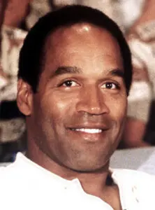 A close up of oj simpson smiling for the camera.