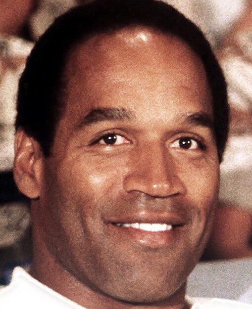A close up of oj simpson smiling for the camera.