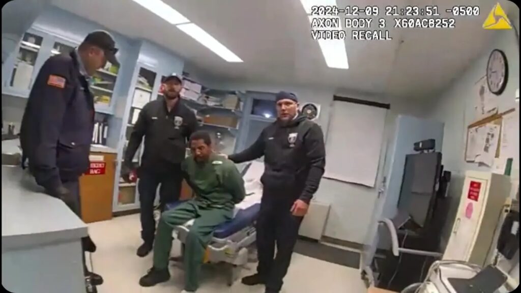 Handcuffed man beaten by prison guard and nurse.