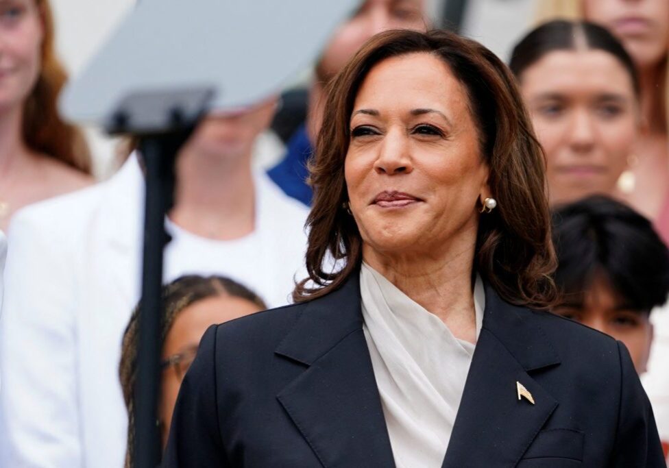 U.S. Vice President Kamala Harris, looks on during an event with the women and men's National Collegiate Athletic Association (NCAA) Champion teams in her first public appearance since President Joe Biden dropped out of the 2024 race, on the South Lawn of the White House, Washington, U.S., July 22, 2024. REUTERS/Nathan Howard