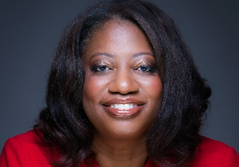 A woman with long hair wearing red shirt.