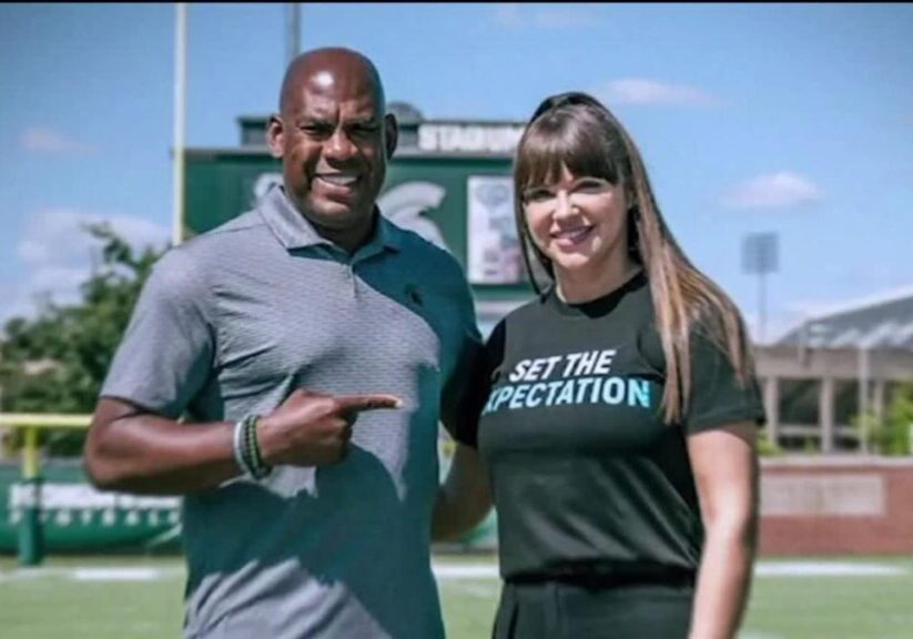 A man and woman posing for the camera.